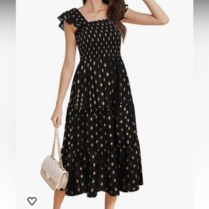black smocked dress with gold polka dots